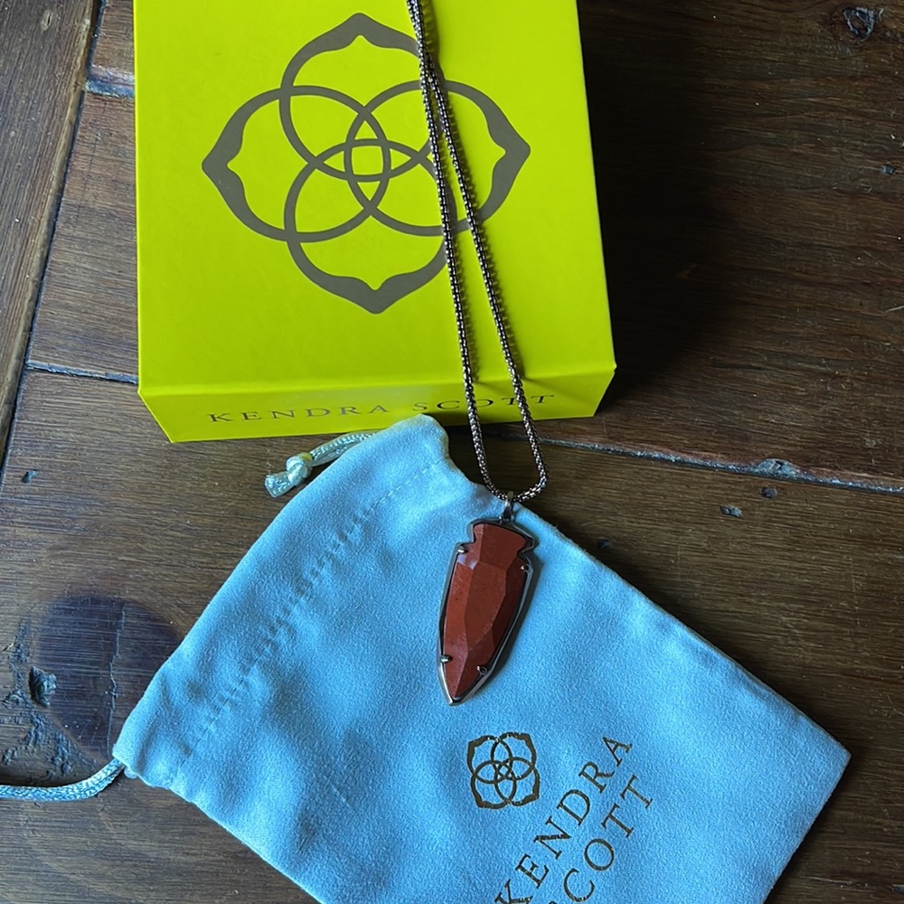 Kendra Scott orange, and rose gold arrowhead necklace